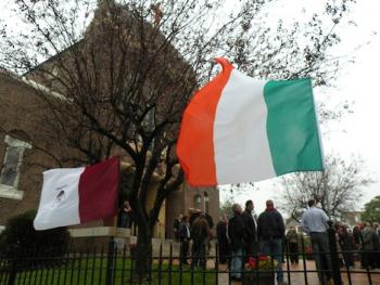 Ciaran Conneely funeral: The Irish and Galway flags flew outside St. Mark's Church following the funeral Mass on Thursday, Oct. 13. Photo by Pat Tarantino